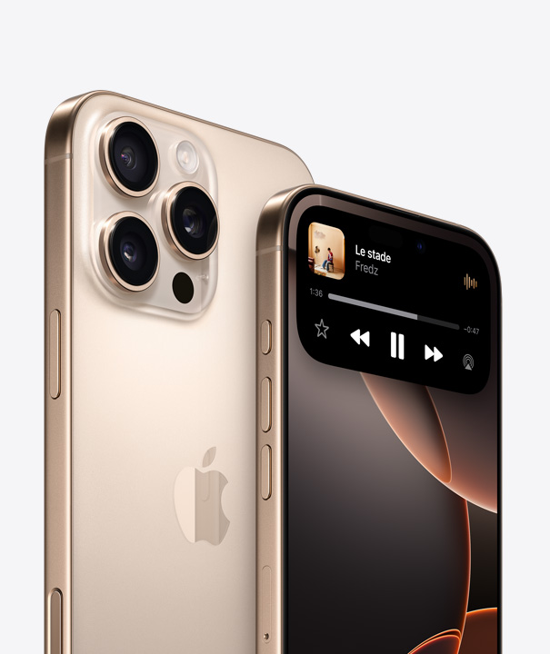 Dos d’un iPhone 16 Pro en titane sable montrant les trois objectifs de la caméra, derrière un autre iPhone 16 Pro dont l’écran affiche Dynamic Island.