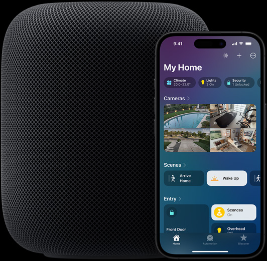 An iPhone — featuring the Home app home screen — is placed slightly infront of a HomePod speaker