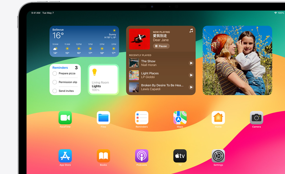 An iPad Pro showcasing Springboard and the different widgets available.