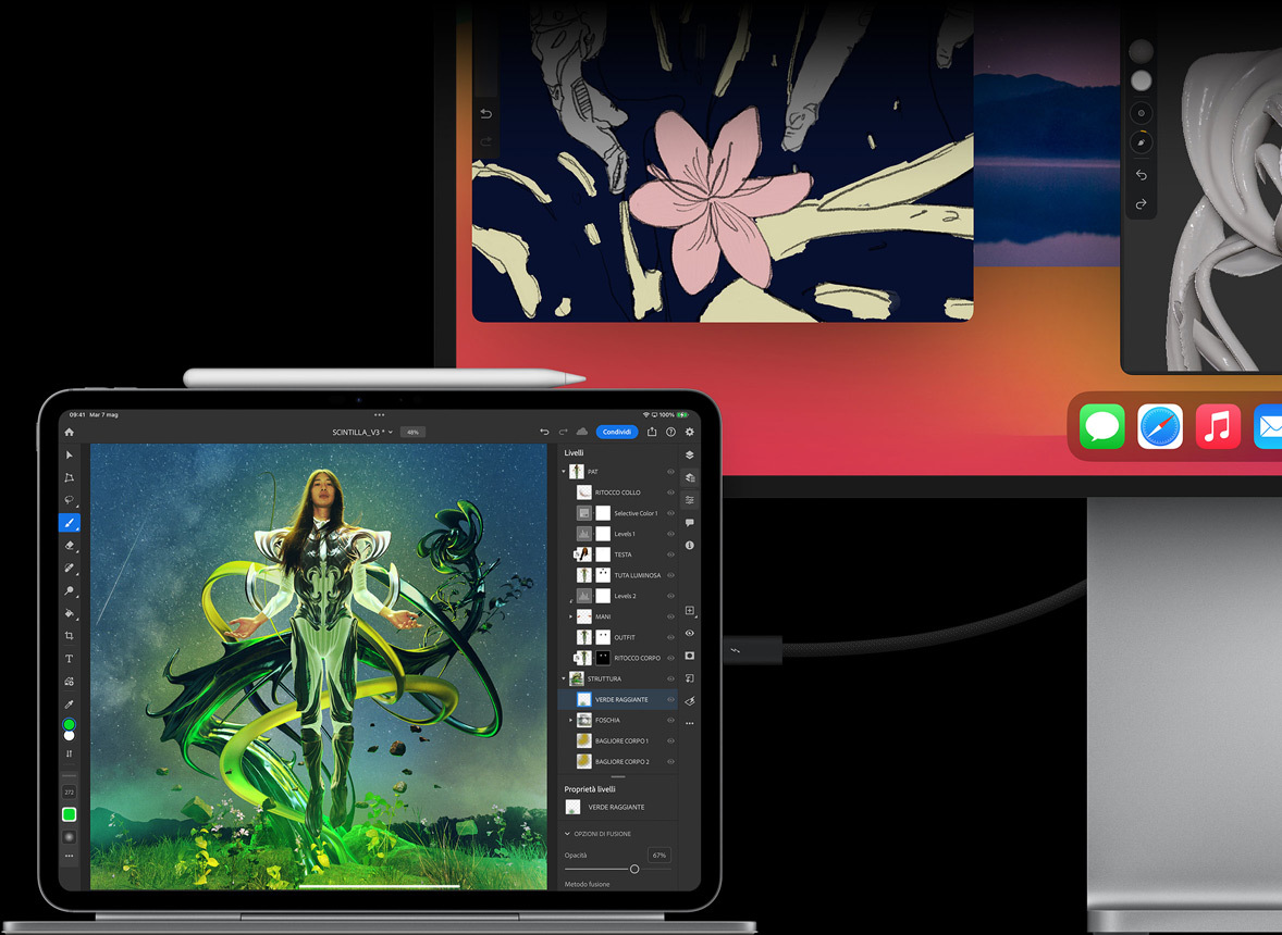 Un iPad Pro in orizzontale agganciato a una Magic Keyboard e collegato a un monitor esterno, entrambi i display mostrano delle immagini che vengono ritoccate