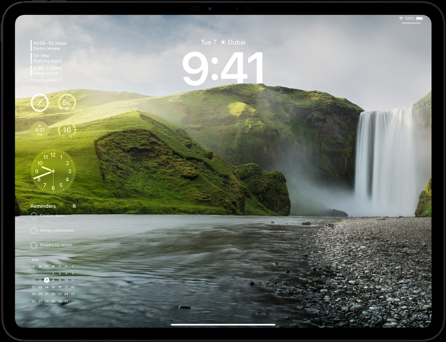 iPad Pro in landscape orientation, screen displaying user's lock screen