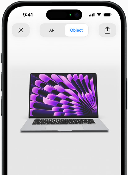 Náhled vesmírně šedého MacBooku Air v rozšířené realitě na iPhonu.